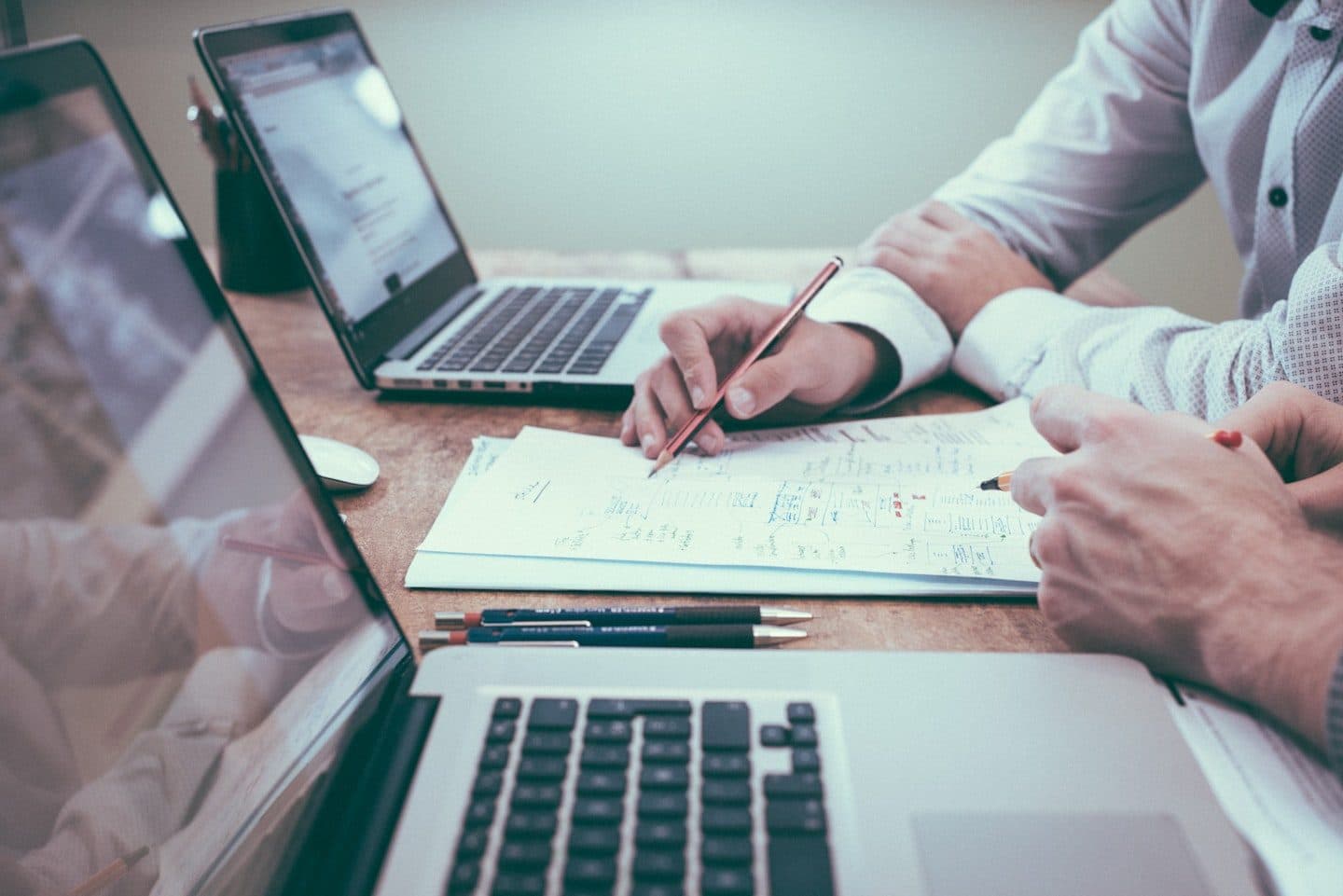 Tax compliance documents and calculator on a desk